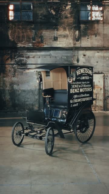 Historic Benz delivery vehicle in an industrial hall.