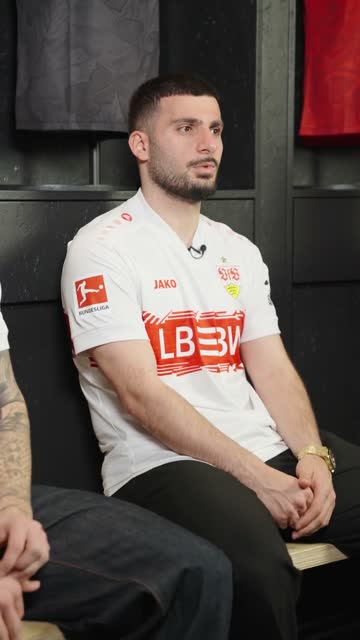 Deniz Undav sitting in the VfB Stuttgart changing room.